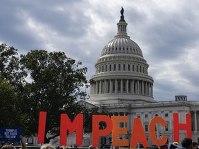 Demonstrators call for the impeachment of U.S. President Donald Trump in Washington, D.C., on Sept. 26, 2019.