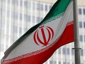 The Iranian flag flutters in front of the International Atomic Energy Agency headquarters in Vienna, Austria, on March 4, 2019.