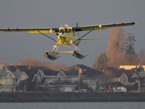 The worlds first electric commercial aircraft owned and operated by Harbour Air is seen landing following its maiden flight in Richmond, B.C., Tuesday, December, 10, 2019. Harbour Air announced in March that it had partnered with engineering firm MagniX in Washington state with the goal of becoming the world's first all-electric airline.