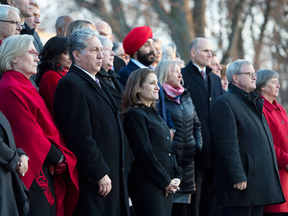 Members of his cabinet listen as Prime Minister Justin Trudeau speaks to reporters following a swearing in ceremony at Rideau Hall in Ottawa, on Nov. 20, 2019.