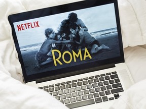 The home screen for the Netflix Inc. original movie "Roma" is seen on an Apple Inc. laptop computer in this arranged photograph taken in the Brooklyn Borough of New York, U.S., on Sunday, Jan. 13, 2019. Netflix is scheduled to release earnings on January 17.