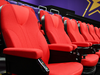 D-Box seats in a movie theatre. Most moviegoers still choose to watch movies in 2D, in regular seats.