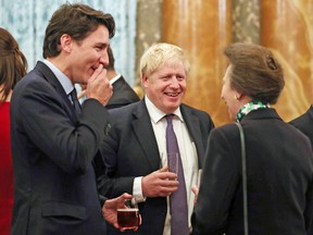 Britain's Princess Royal Anne talks to Canadian Prime Minister Justin Trudeau and Britain's Prime Minister Boris Johnson during a reception on December 3, 2019.