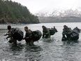 Navy SEALs perform advanced cold weather training in Kodiak, Alaska.