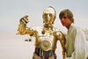 Luke Skywalker (Mark Hamill) with C-3P0 in Star Wars Episode IV: A New Hope.