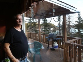 Former town councillor Dennis Budgell, who initiated the resettlement talks, looks out of his window at home in Little Bay Islands, N.L. on Friday, November 15, 2019. Little Bay Islanders are saying goodbye as the Newfoundland and Labrador town resettles, but some are eyeing a return.