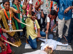 Demonstrators from the National Congress Party (NCP) burn a dummy of a rapist as they protest against rapes in Ranchi, Vadodara, Surat and other regions, following the alleged rape and murder of a 27-year-old veterinary doctor in Hyderabad, in Ahmedabad on December 4, 2019.