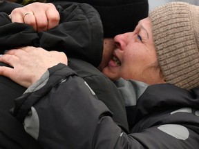 Ukrainian Ivan Katyshev - who was made prisoner - is embraced by his mother Lyudmila after being exchanged during a prisoner exchange between Ukraine and pro-Russian rebels near the Mayorsk checkpoint on December 29, 2019.