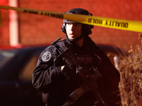 A police officer secures the scene of a shooting that left multiple people dead on Dec. 10, 2019 in Jersey City, New Jersey.