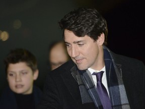 Prime Minister Justin Trudeau and son Xavier arrive in London on Monday, Dec. 2, 2019.