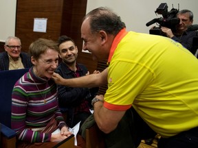 British Audrey Mash and her husband Rohan Schoeman speak with medical staff at Vall d'Hebron hospital in Barcelona, Spain, December 5, 2019.