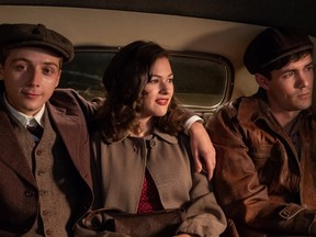 Dovidl (played by Jonah Hauer-King), Martin (played by Gerran Howell) and Helen in the back of a taxi in The Song Of Names.