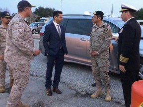 Saudi Arabia Defense Attache Major General Fawaz Al Fawaz and his Embassy staff and other officials arrive to meet with the Saudi students who remain restricted to the Naval Air Station (NAS) Pensacola base by their Saudi commanding officer, in Pensacola, Florida, U.S. December 9, 2019. Picture taken December 9, 2019.