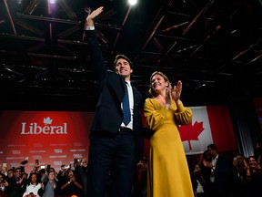 Prime Minister Justin Trudeau and wife Sophie Gregoire-Trudeau celebrate the Liberal party's election win in Montreal on Oct. 21, 2019.
