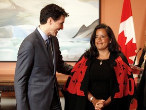 Prime Minister Justin Trudeau speaks to newly appointed Veterans Affairs Minister Jody Wilson-Raybould following a cabinet shuffle on Jan. 14, 2019. The SNC-Lavalin scandal broke soon afterwards.