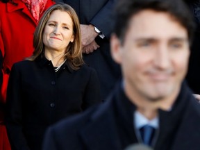 Deputy Prime Minister Chrystia Freeland listens as Prime Minister Justin Trudeau speaks during a news conference after presenting his new cabinet, at Rideau Hall in Ottawa, on Nov. 20, 2019.