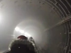 Twitter user Tyler Patterson filmed a line of commuters trudging down a subway tunnel after they were forced to evacuate a train due to smoke from a fire.