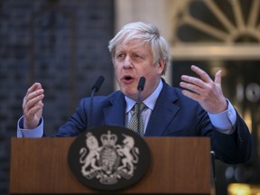 Boris Johnson, U.K. prime minister, gestures while delivering a speech outside number 10 Downing Street in London, U.K., on Friday, Dec. 13, 2019. Johnson won an emphatic election victory that redraws the political map of Britain and gives the prime minister the mandate he needs to pull the U.K. out of the European Union next month.