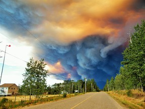 Driven by strong winds and hot, dry conditions, a massive wildfire threatens ranch lands along Francois Lake, B.C., in August 2018.