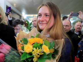 Convicted Russian agent Maria Butina, who was released from a Florida prison and then deported by U.S. immigration officials, holds flowers upon her arrival at Sheremetyevo International Airport outside Moscow, Russia October 26, 2019.