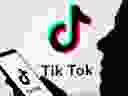 A person holds a smartphone with TikTok logo displayed in this picture illustration taken November 7, 2019.