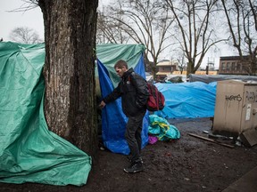 Shane Redpath is seen outside a tent he shares with another person at a homeless camp at Oppenheimer Park in the Downtown Eastside of Vancouver, on Friday December 13, 2019.