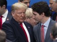 President Donald Trump (L) and Canadian Prime Minister Justin Trudeau (R) attend the NATO summit at the Grove Hotel on December 4, 2019 in Watford, England.