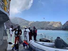 Members of a dive squad conduct a search during a recovery operation around White Island, which is also known by its Maori name of Whakaari, a volcanic island that fatally erupted earlier this week, in New Zealand, December 13, 2019 in this handout photo supplied by the New Zealand Police.