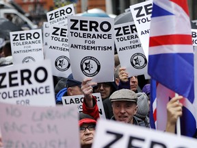 People campaign against anti-Semitism outside the head office of the British Labour Party in London, England, in a file photo from April 8, 2018.