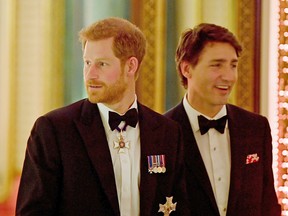 Prince Harry and Prime Minister Justin Trudeau arrive at the Queen's Dinner during the Commonwealth Heads of Government Meeting at Buckingham Palace on April 19, 2018 in London.