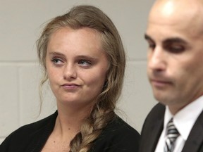 In this Aug. 24, 2015 file photo, Michelle Carter listens to defence attorney Joseph P. Cataldo argue for an involuntary manslaughter charge against her to be dismissed at Juvenile Court in New Bedford, Mass.