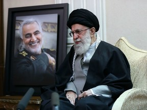 A handout picture provided by the office of Iran's Supreme Leader Ayatollah Ali Khamenei on January 3, 2020, shows him  visiting the family of killed Iranian Revolutional Guards commander Qasem Soleimani (picture), in the capital Tehran.