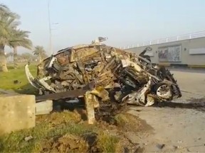 A destroyed car, claimed to belong to Qassem Soleimani and Abu Mahdi al Muhandis, is seen near Baghdad International Airport.