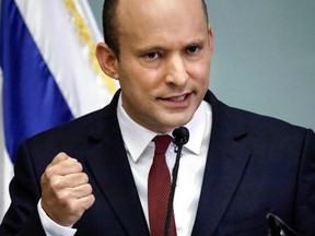 Israeli Education Minister Naftali Bennett speaks as he gives a joint statement with the justice minister (unseen) at the Knesset in Jerusalem on November 19, 2018.