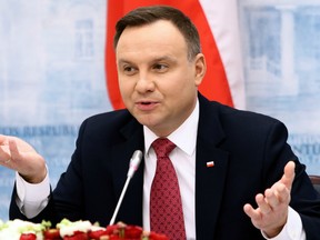 Poland's President Andrzej Duda gestures as he gives a press conference with the Lithuanian President following talks in Vilnius on February 17, 2018.
