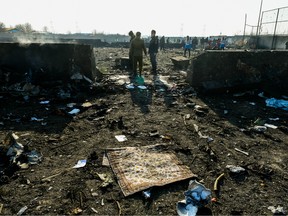 Debris from the wreckage of a Boeing Co. 737-800 aircraft, operated by Ukraine International Airlines, which crashed shortly after takeoff covers the site near Shahedshahr, Iran, on Wednesday, Jan. 8, 2020.