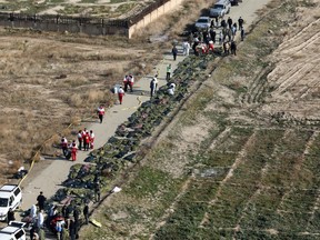 Passengers' dead bodies are pictured at the site where the Ukraine International Airlines plane crashed after take-off from Iran's Imam Khomeini airport, on the outskirts of Tehran, Iran January 8, 2020.