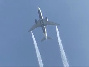 Delta Airlines Flight 89, a Boeing 777-200 jet, empties its fuel tanks as it makes an emergency landing at Los Angeles International Airport. As seen from Ocean View Elementary School in Whittier, California on Jan. 14, 2020, in this still video image.