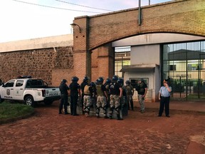 Handout pictures released by Paraguay's ABC TV showing armed forces taking position following the escape of 76 inmates from the prison in Pedro Juan Caballero, 500 kilometres northeast of Asuncion, on January 19, 2020.