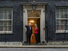 Boris Johnson, U.K. prime minster, left, and Ursula von der Leyen, president of the European Commission, gesture to photographers on the steps of number 10 Downing Street in London, U.K., on Wednesday, Jan. 8, 2020.
