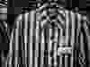 Prisoner uniform, 1940–44. The striped uniform was used throughout the concentration camp system. Auschwitz-Birkenau State Museum, Oswiecim, Poland. Exhibition installation, Centro de Exposiciones Arte Canal, Madrid, 2017.