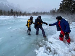 Three American tourists were stranded on an island in the Bow River near Canmore Wednesday after an ice bridge shifted and collapsed. Canmore Fire Rescue / Twitter