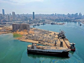 Damaged ships sit in the Port of Beirut on Aug. 7, three days after a colossal explosion of a huge pile of ammonium nitrate that had languished for years in a port warehouse left scores of people dead or injured and caused devastation in the Lebanese capital.