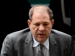 Harvey Weinstein uses a walker as he arrives at the Manhattan Criminal Court, on January 7, 2020 on the second day of his criminal trial on charges of rape and sexual assault in New York City.