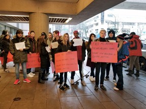 Protestors stand outside a Vancouver courtroom on January 20, 2020, pressing for the release of a senior Chinese telecommunications executive fighting extradition to the United States.
