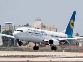 In this file photo taken on July 4, 2017 a Boeing 737-3E7 from Ukraine Int. Airlines lands at Israel's Ben Gurion International airport on the outskirts of Tel Aviv. - A Ukrainian plane that crashed on January 8, 2020 shortly after take-off in Tehran was carrying 170 passengers, Iran's semi-official ISNA news agency reported. The Boeing 737 had left Tehran's international airport bound for Kiev, the agency said, adding that 10 ambulances were sent to the crash site.