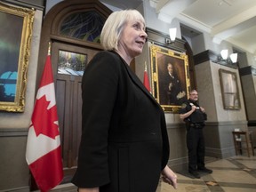 Minister of Health Patty Hajdu makes her way through the Foyer of the House of Commons to speak with the media Thursday January 30, 2020 in Ottawa.