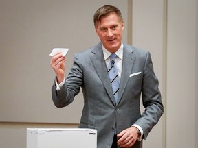 People's Party of Canada (PPC) leader Maxime Bernier casts his ballot as he votes in the 2019 federal election in Beauce, Quebec, Canada October 21, 2019.