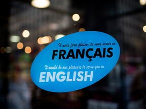 A bilingual sign hangs outside a shop in Montreal in a file photo from July 8, 2013.