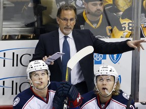 FILE - In this Friday, Feb. 3, 2017, file photo, Columbus Blue Jackets head coach John Tortorella gestures to an official during the first period of an NHL hockey game against the Pittsburgh Penguins in Pittsburgh.